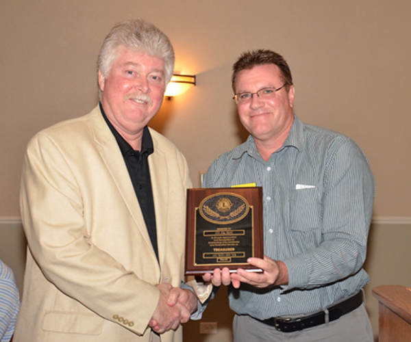 Will Ruemmele presents Bill Henry with the Club Treasurer Plaque