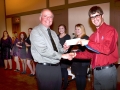 Ray Jacobson presents check to Badger H.S. for their singing at the Christmas Party.
